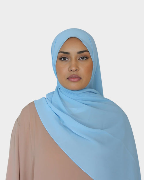 HIJABI LONDON baby blue chiffon hijab. Lightweight, breathable, and textured for easy styling.