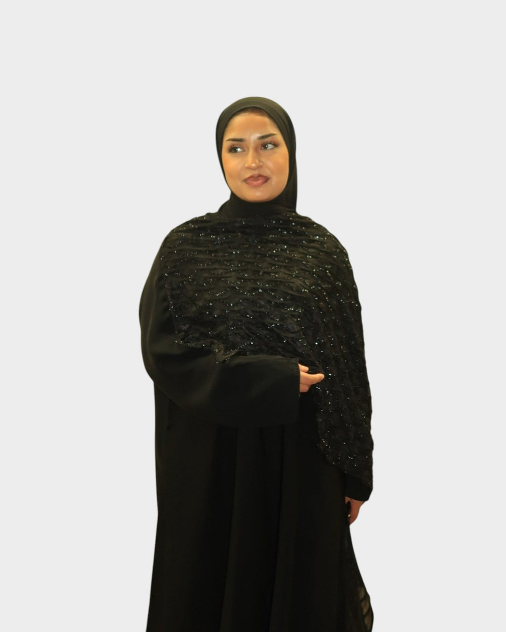 HIJABI LONDON Layali black abaya with wrap sleeves and beaded floral embroidery. Includes matching chiffon hijab.