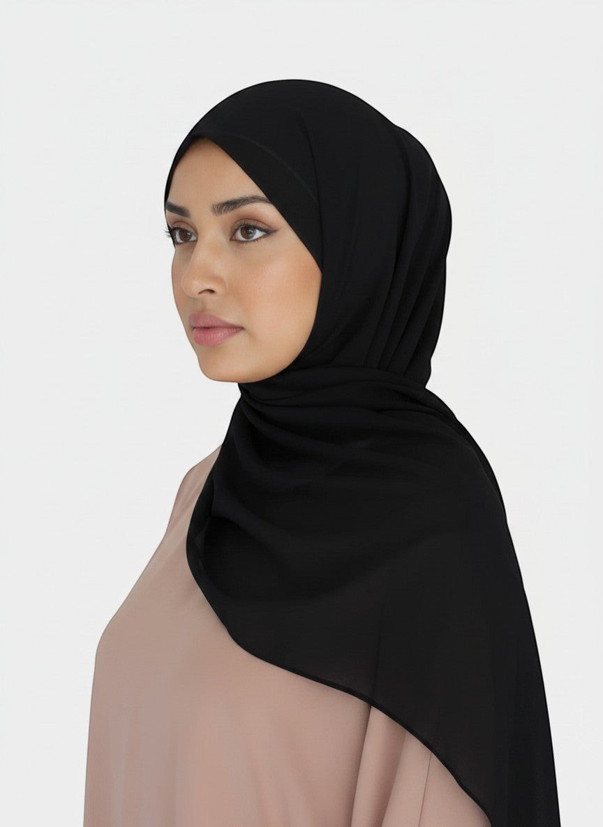 HIJABI LONDON black chiffon hijab worn by a model, lightweight and elegant drape, perfect for everyday or formal wear.