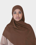 HIJABI LONDON brown chiffon hijab worn by a woman. Lightweight, breathable, and elegant for versatile styling.