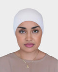 HIJABI LONDON cream tie back undercap made of soft, breathable cotton. Elasticated gathered design for secure fit.