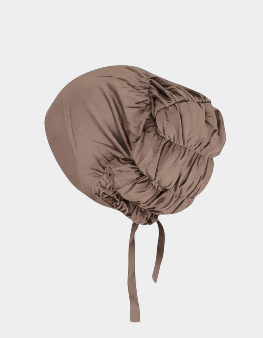 HIJABI LONDON navy blue ruched modal hijab with adjustable tie closure and complementary undercap included.