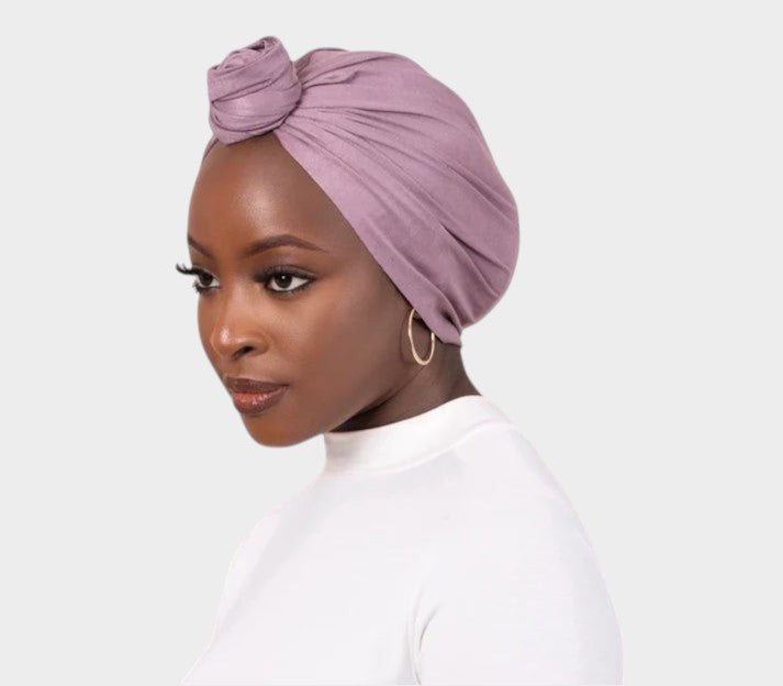 HIJABI LONDON purple faux suede turban wrap with a knot detail. Comfortable, non-slip, one-size-fits-all design.