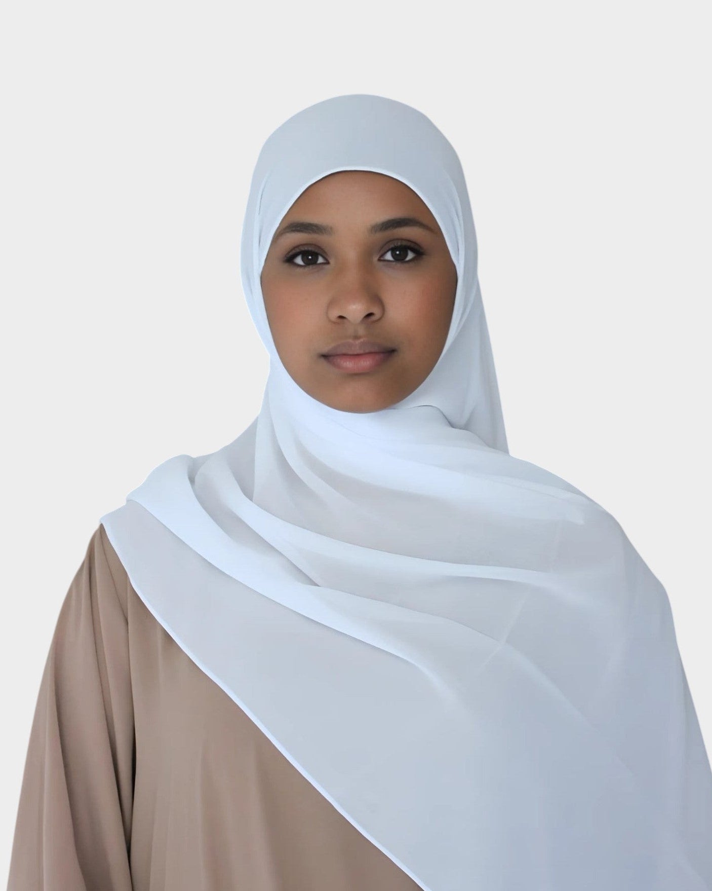 HIJABI LONDON Snow White Chiffon Hijab. Lightweight, breathable, and elegant white chiffon hijab with a textured finish for versatile styling.