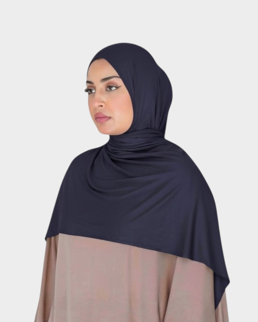 HIJABI LONDON taupe premium jersey cotton hijab with a slight stretch for easy styling. Model wears it for everyday or special occasions.