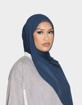 HIJABI LONDON teal modal hijab draped on a model, offering lightweight comfort and a soft, smoky depth.