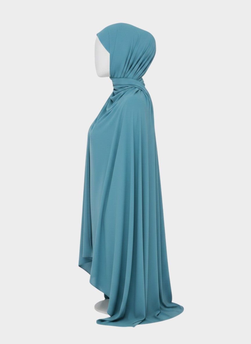 HIJABI LONDON teal moss chiffon hijab draped on a mannequin, lightweight and breathable fabric